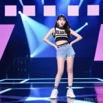 Home 16 수지 아이돌 시절 이야기 - A vibrant full-body shot of young Suzy, around 16-17 years old, confidently performing on a brightly...